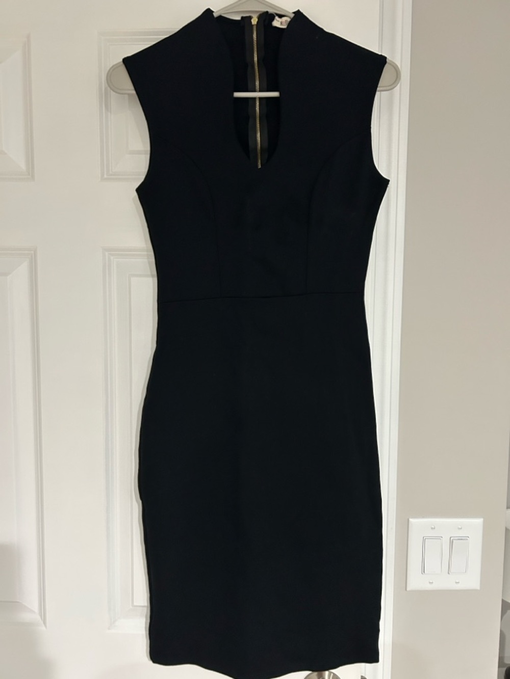 Sleeveless Black Midi Dress with V-Notch Neckline